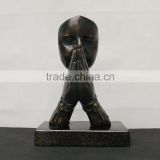 praying hand statue