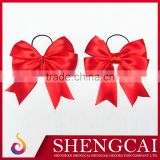 Red ribbon bow with elastic loop