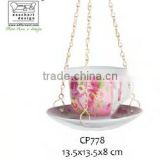 hanging ceramic teacup bird feeder ass in print
