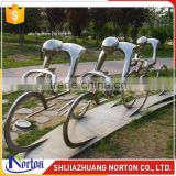 Abstract characters ride stainless steel sculpture for garden decor NTS-012L