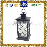 Black plastic decorative lantern with lattice pattern and glass sides