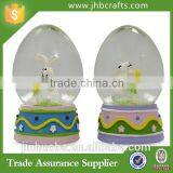 Set of Egg Shaped Easter Bunny Rabbits Snow Globe thumbnail-1