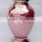 pink coloured shiny finished metal urns