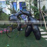 Fiberglass Lover Sculpture With Bike thumbnail-1