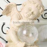 Resin Solar Lighting Angle Figurine Holding a Luminur Glass Globe Garden Ornamenet