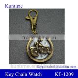 Bronze vintage watch with keychain decorate with motorbike