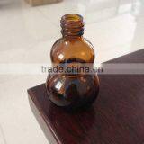 Unique Shaped Amber Boston Round Glass Bottles thumbnail-1