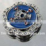 China Wholesale High Quality Skeleton Purse Hanger, Skull Epola Rhinestone Table Bag Hanger for Lady