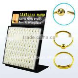 Display board with 96 pcs. of real gold 18k plated sterling silver nose hoops with and without ball