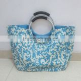 New&Hot Sales shopping bag with aluminum handle and side pockets.