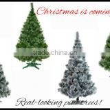 Realistic - looking artificial Christmas tree with stand