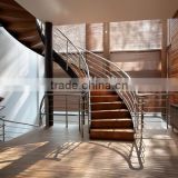 closed riser wood curved stairs with stainless steel rails
