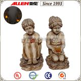 15" Factory direct garden solar light sitting polyresin boy and girl statue