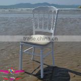 white wooden napoleon chair with hard padded cushion