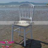 white wooden napoleon chair with hard padded cushion