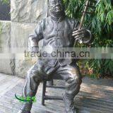 Brass Asian Musician Playing the Fiddle