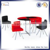 Glass dining table with chairs around