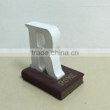 Polyresin book with letter figure