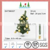 Set of hanging balls and small artificial christmas tree