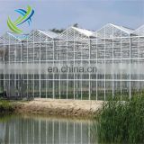 Glass greenhouse with cooling pad and fan