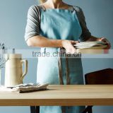 Custom blue cotton canvas kitchen apron with cross-back straps