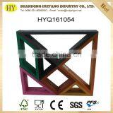 tangram shape wooden display rack against wall