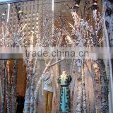 Artificial Tree Trunk Clothing Shop Windows Design