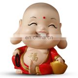 laughing and sitting little monk religious figure for gifts and decoration