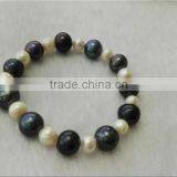 AAA 4-7mm Round White and Black Freshwater Pearl Bracelet thumbnail-1