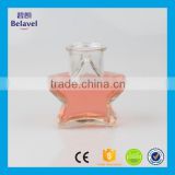 Xuzhou factory supply five star shaped cheap clear glass bottle
