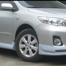 The Toyota Corolla Car is Surrounded by a 11-13 Carora Front and Rear Spoiler Skirt thumbnail-3