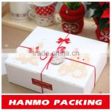christmas cardboard gift box with red ribbon bow