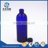 Cylinder blue glass pharmaceutial bottle boston bottle