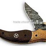 A HANDMADE ENGRAVED COPPER BOLSTERS WITH BROWN G-10 HANDLE, DAMASCUS STEEL LINER LOCK FOLDING KNIFE thumbnail-1