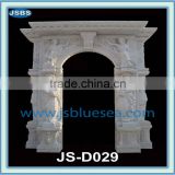 Large white marble door frame with human statue