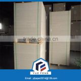 Laminated grey paperboard for industrial wrapping