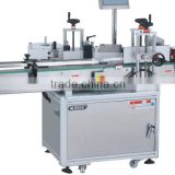 Automatic vertical labeling machine for round bottles