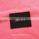 Wood spindle satin weaving label