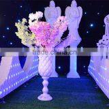 White wedding centerpiece tall vases flower stands