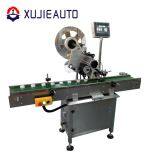 Автоматическая машина для плоского нанесения наклейок на аптечные коробки