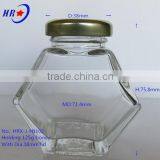 Holding 125g Honey Glass Jar With Golden Lid