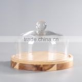glass dome with cheese board in middle