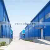 Large Prefab Factory With Metal Frame Blue Cladding Short Brick Wall
