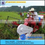 Whirlston working in INDIA middle rice paddy grain combine harvest machine