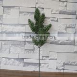 Plastic green pine tree branch