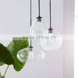 11.26-6 With Glass Shades in a Slight Green Tint Glass Triplet Chandelier Three Shades Vary in Size and Hanging Height