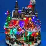 Polyresin Christmas Decoration 13” Led Gingerbread House With Rotating Figurines thumbnail-1