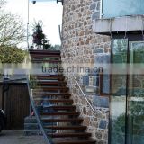 out metal curved Staicase with ceder step glass railings