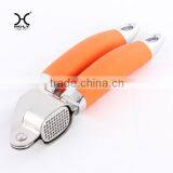 The Garlic Press With 0range Handle