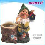 Resin dwarf statue with plant pot